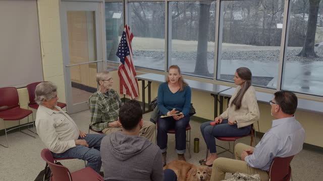 Confident therapist leading support group for veterans