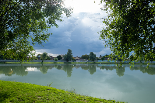 A lake surrounded by greenery.