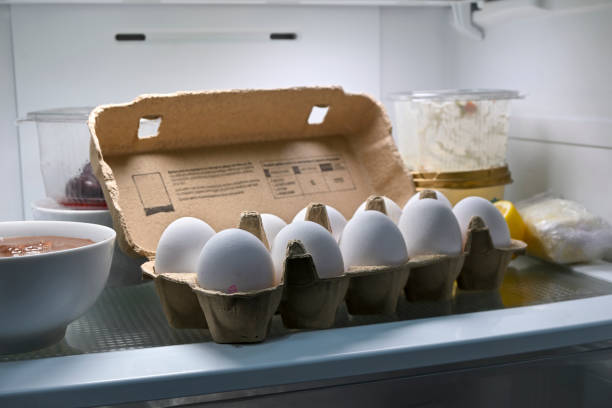 eggs in a fridge stock photo