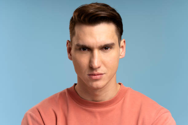 istock Portrait of attentive self confident man looking at camera with serious expression 1471035415