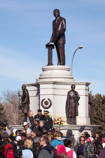 A large and diverse crowd gathers at the Martin Luther King Jr. statue in Denver Colorado's City Park for his annual parade and march or marade, one of the largest Martin Luther King Jr. rallies in the United States.