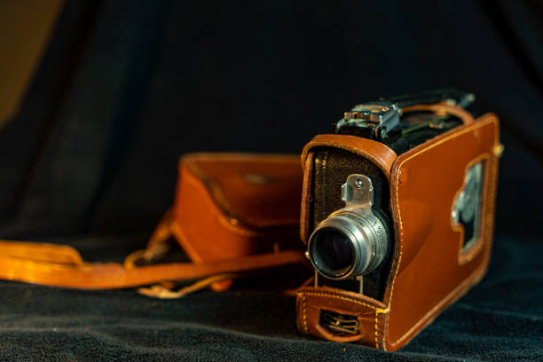 Vintage Black Camera on Dark Wooden Background - Retro Photography Concept