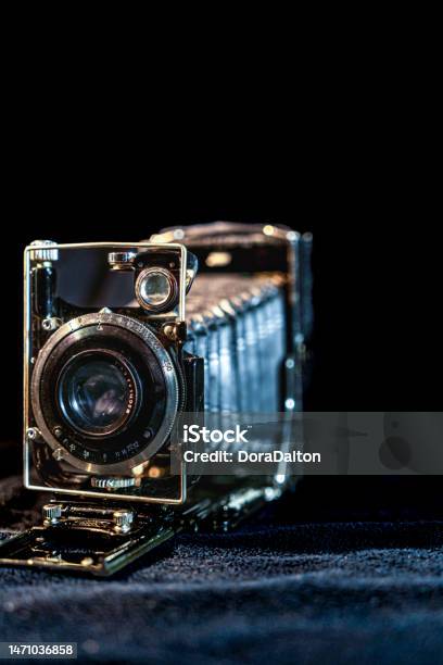 Antique Fold Photocamera On Black Background Stock Photo - Download Image Now - Ancient, Antique, Aperture