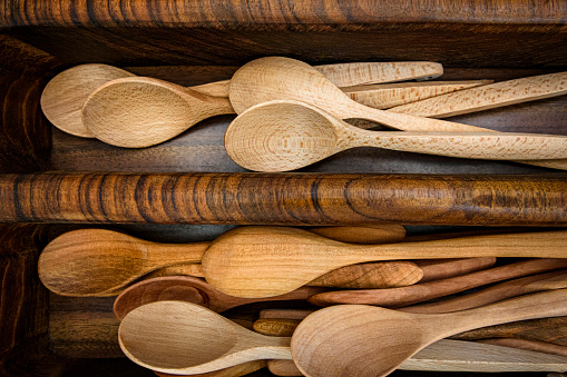 Wooden spoons in a cutlery tray - kitchen utensils