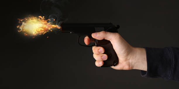 istock Man shooting handgun on black background, closeup. Banner design 1471047526