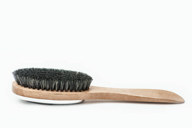 Clothes brush duster scrub wooden brushing tool nobody white background stock photo