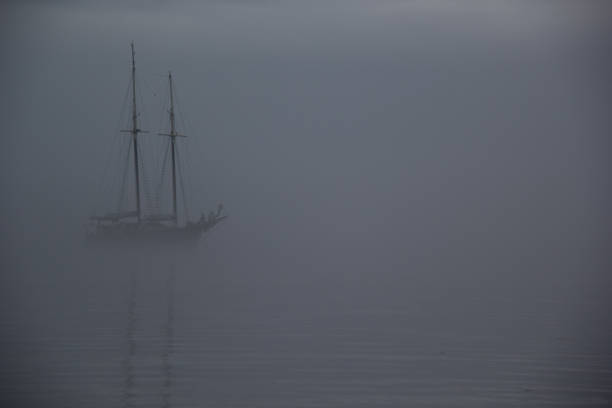 Ghost ship hiding in fog Ship on a foggy morning, ghost ship in fog ghost ship stock pictures, royalty-free photos & images