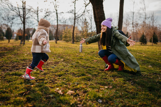 istock Young mother and her son having fun in a public park 1471056888