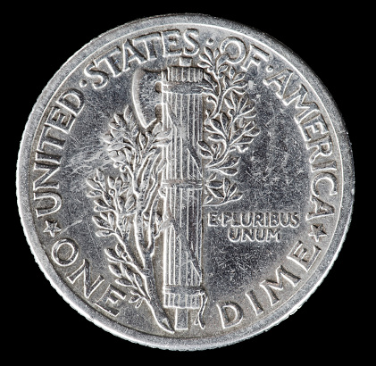 Reverse side of a 1940 silver Mercury dime close up on black background.