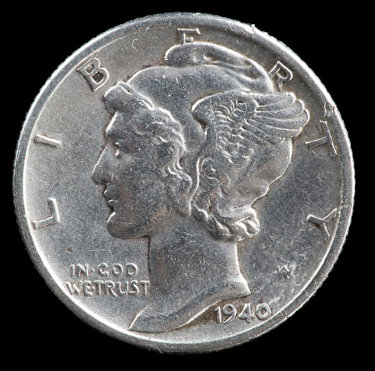 1940 silver Mercury dime close-up on black background.