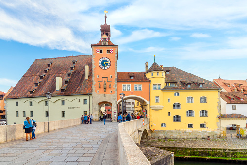 The historic Brueckturm Tower and city gate (Steinerne Brücke) leading to the Altstadt Old Town from the old stone bridge in the Bavarian city of Regensb