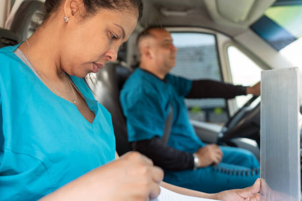 istock Woman reading medical informs inside an ambulance 1471061856
