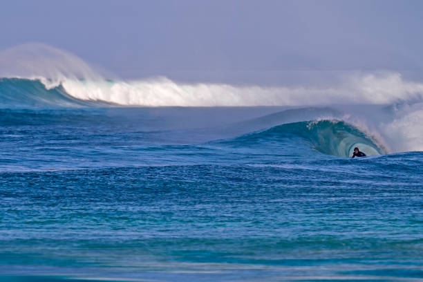 istock Surfer peeking out of a barrel Sunset Beach 1471062148
