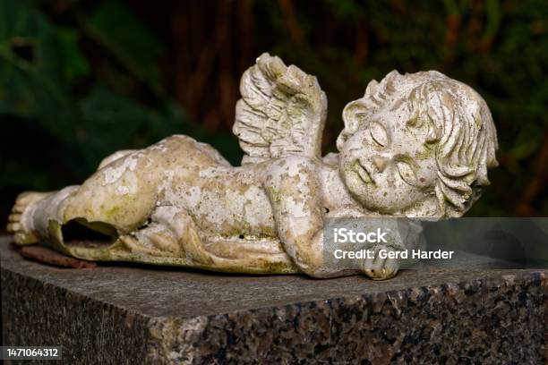 Weathered Small Winged Angel Stock Photo - Download Image Now - Small, Statue, Angel