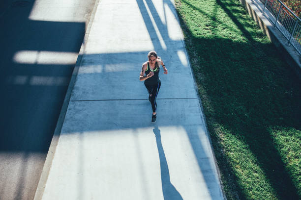 istock Sportswoman running 1471064513