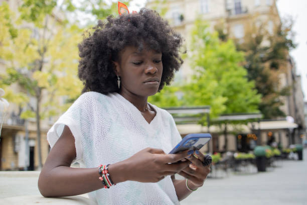 istock Happy young woman using phone 1471065817