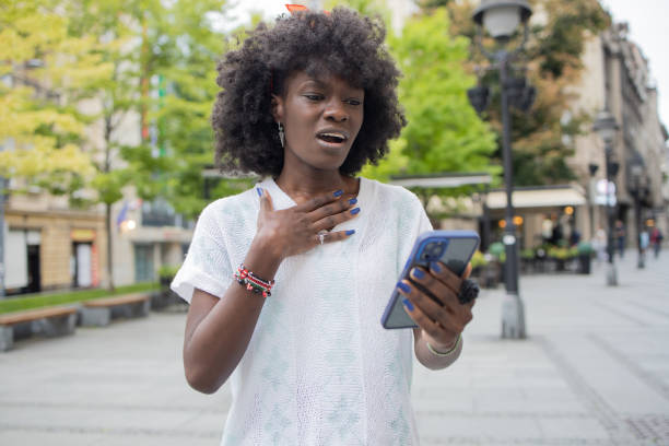 istock Happy young woman using phone 1471065825
