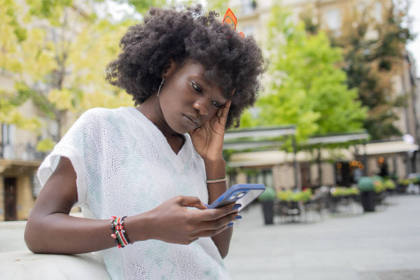 istock Happy young woman using phone 1471065833