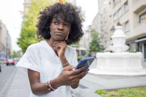 istock Happy woman using phone 1471065844