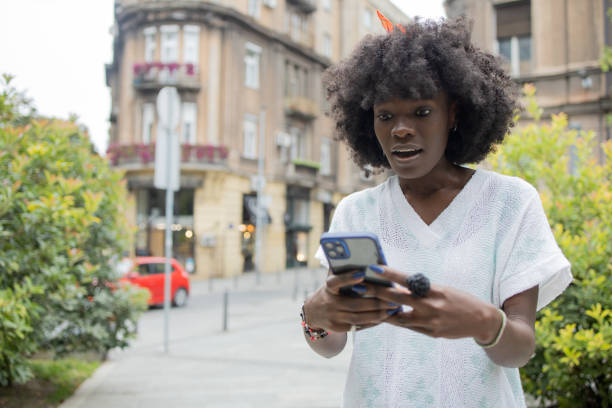istock Happy woman using phone 1471065853