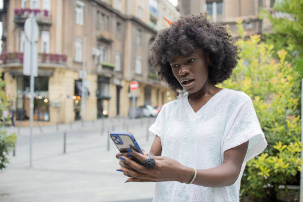 istock Happy young woman using phone 1471065854
