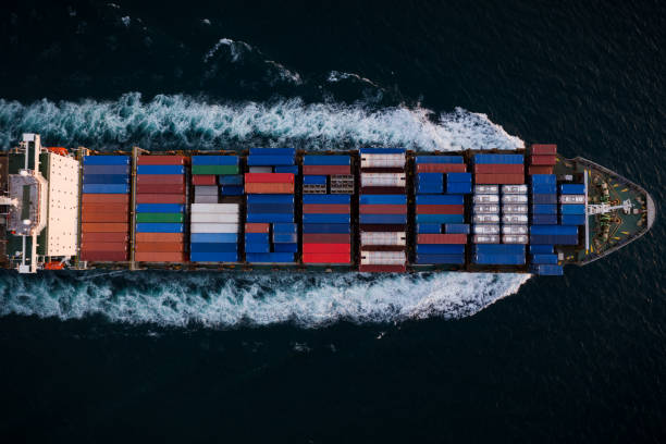 istock Container ship sailing fast in sea top view at night process, service and international transport by shipping concept 1471067103
