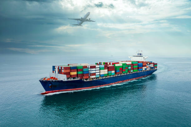 istock container ship sailing full speed to transport goods in containers for import export internationally and worldwide, business services transportation by container ship open sea, aerial front view from drone, airplane sky background, 1471067399