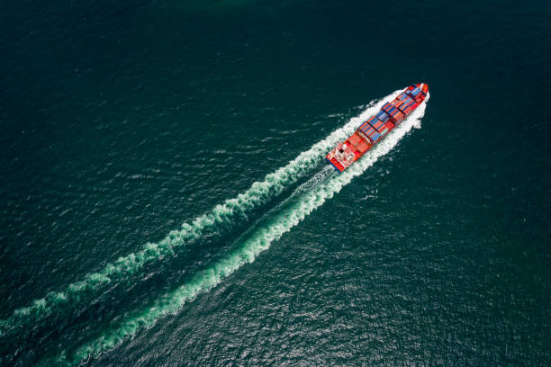istock container cargo ship sailing full speed in pacific ocean to transport goods import export internationally or worldwide as business and industrial transport and marine services open sea aerial top view from drone 1471067498