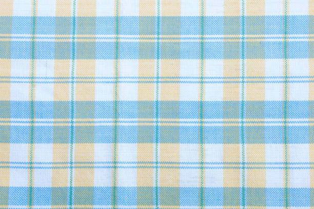 Colored woven fabric has beautiful patterned lines for the background.