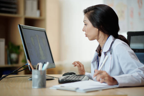 istock Doctor Examining Chest X-ray 1471076086