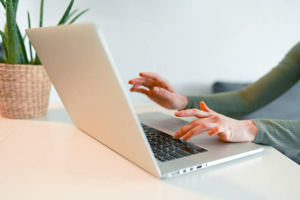 istock Closeup of hands and laptop computer , typing on keyboard, searching information, browsing in internet. 1471076546