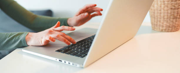 istock Closeup of hands and laptop computer , typing on keyboard, searching information, browsing in internet. 1471076547