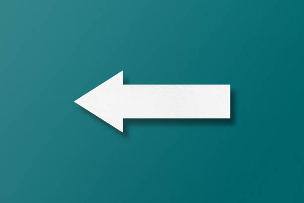 istock white paper arrow isolated on green paper background 1471080466