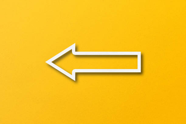 istock white paper arrow isolated on yellow paper background 1471080480