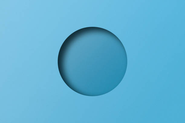 istock Light blue paper cut into circular holes stacked together with light and shadow. 1471080566