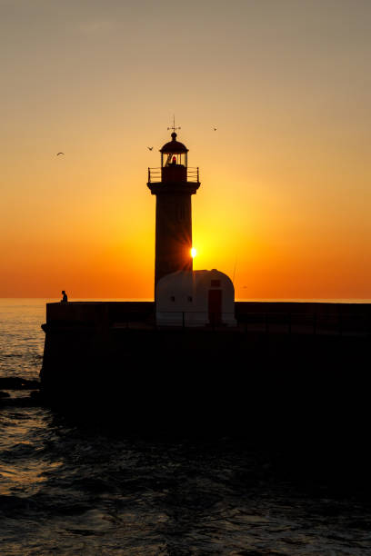 istock Ocean lighthouse at the sunset. 1471080691