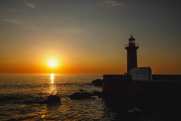 istock Silhouette of an old lighthouse during the sunset. 1471080719