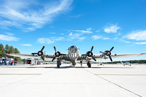 Flagstaff, Arizona, USA – April, 05 2011: The Aluminium Outcast B17 Flying Fortress WW2 Bomber stands on the tarmac at Flagstaff Airport during a flying day for the public