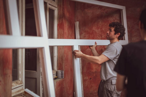 istock Caucasian male builder carries window frames. 1471085624