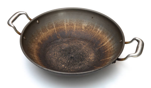 istock angle view dirty cooking pan on white background 1471085830