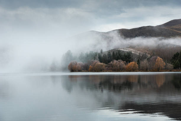 Misty lake in the swiss alps captured during summer season at an altitude of 1700m in the canton of glarus.
