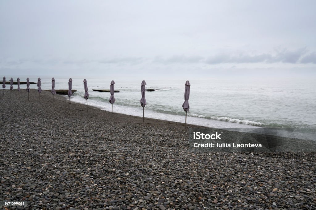 Deserted beach on the Black Sea coast of Sochi against the cloudy sky, Adler, Krasnodar Territory, Russia Adler District Stock Photo