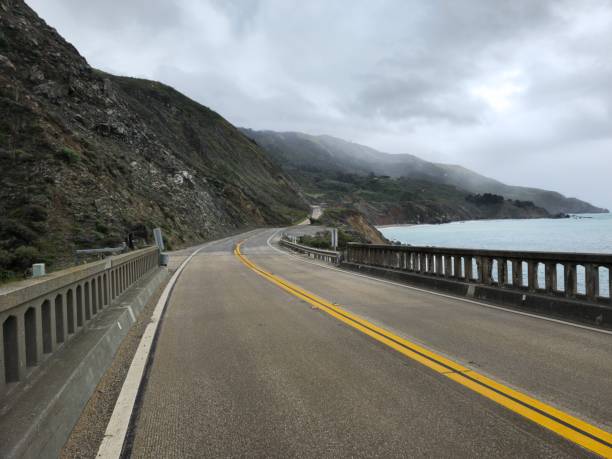 istock Foggy mountain and road 1471101086