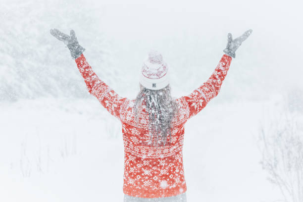 istock Woman out in the forest with heavy snow falling 1471106585