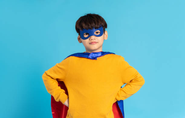 istock The image of a boy wearing a cape transforms into a hero 1471107560