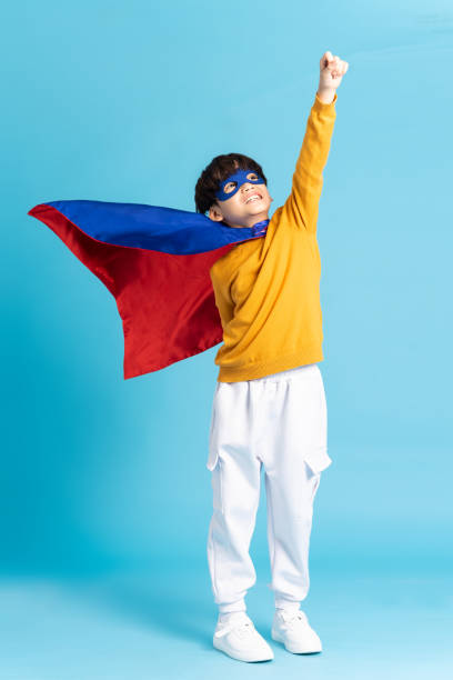 istock The image of a boy wearing a cape transforms into a hero 1471107563