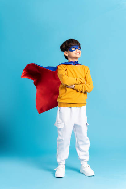 istock The image of a boy wearing a cape transforms into a hero 1471107571