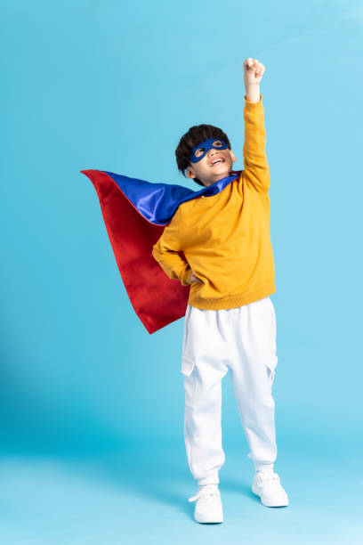 istock The image of a boy wearing a cape transforms into a hero 1471107572