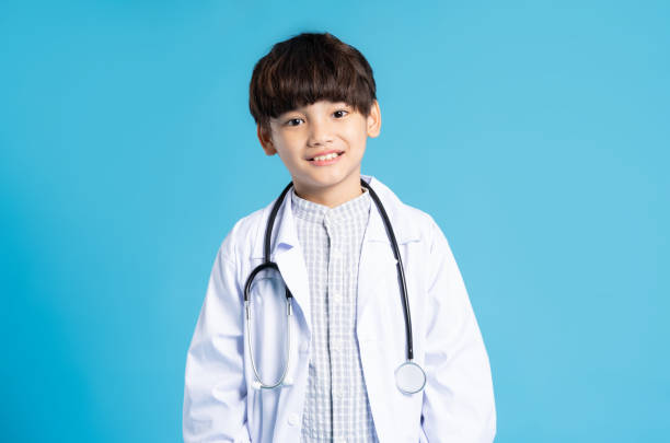 istock Asian boy portrait posing on blue background 1471107946
