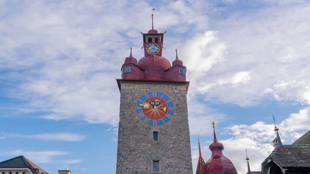 4k uhd timelapse footage of Town hall clock tower with cloud moving sky background, Lucerne, Switzerland